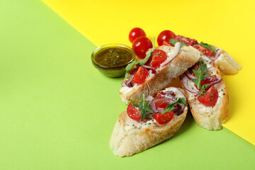 Delicious italian snacks bruschetta on two tone background