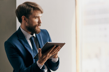 man in suit professional job technology tablet official