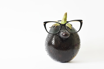vegetable round eggplant funny shape s with a nose in glasses on a white background.
