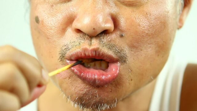 Close Up Man Eating Pork Satay ,in Studio Chiangmai  Thailand.