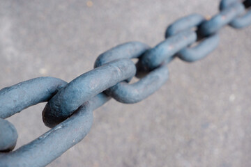 A giant metal chain. Links of an iron chain close up.