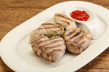 Grilled pork tenderlion with tomato sauce