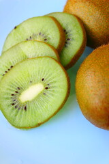 kiwi fruit on a blue background, health