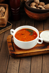 Russian dish solyanka prefabricated meat soup with sour cream