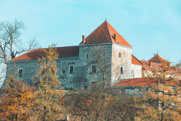 Fototapeta na wymiar view of old european castle at yellow autumn season