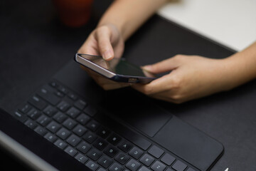 Top view of girl hands touching on smartphone