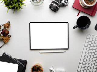 Digital smart tablet blank screen mockup surrounded by accessories stuff on white background