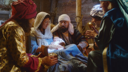 Fototapeta Magi speaking with Joseph and Mary about Jesus Christ birth obraz