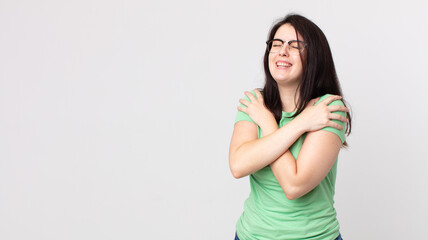 pretty woman feeling in love, smiling, cuddling and hugging self, staying single, being selfish and...