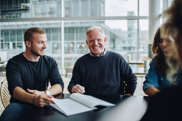 Happy group of professionals in meeting