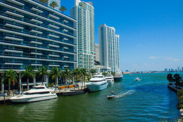 Fototapeta na wymiar Cityscape of Miami, view of the embankment in summer, ocean and skyscrapers