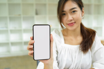 Focused smartphone blank screen mockup holding by beautiful female