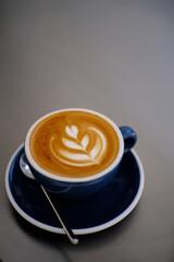 Awesome Latte art hot coffee drink on table in coffee shop cafe