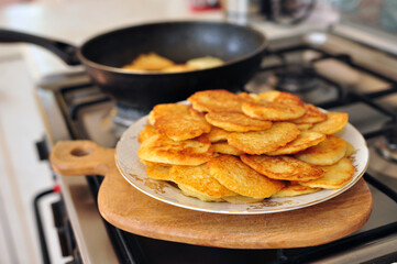 Cooking of Tasty potato pancakes on a gas stove