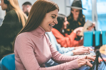 Coworker girl working inside modern coworking office - Startup concept - Focus on face