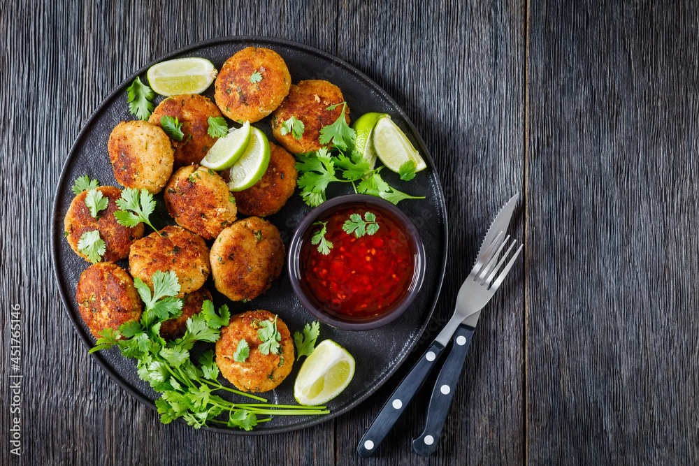 Sticker Tod man pla, thai fish cakes on a plate