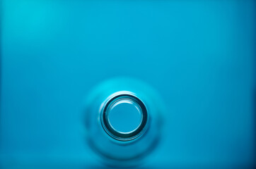 Photo of glass bottle neck. Blurred.