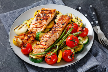 grilled salmon and vegetables on a plate