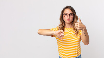 pretty thin woman feeling confused, clueless and unsure, weighting the good and bad in different...