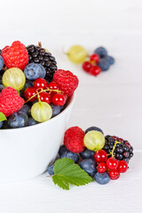 Berries fruits berry fruit strawberries strawberry blueberries blueberry portrait format in a bowl