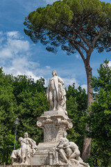 Fototapeta na wymiar The Goethe monument is in Rome on Viale Goethe in the Villa Borghese . It was designed by the German sculptor Gustav Eberlein on behalf of Kaiser Wilhelm II 