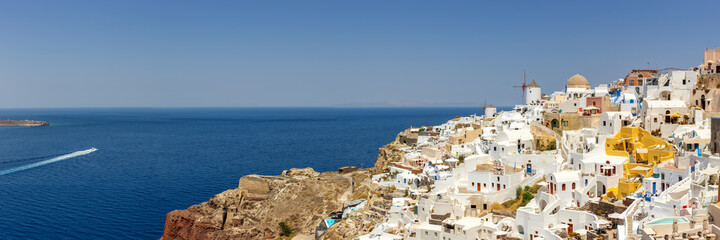 Santorini island holidays in Greece travel traveling Oia town Mediterranean Sea with windmills...