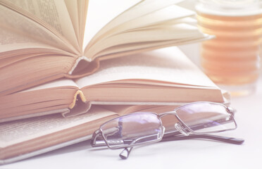 mug of hot tea and books