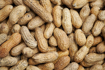 Fototapeta premium Close up of peanuts with shell. Food background.