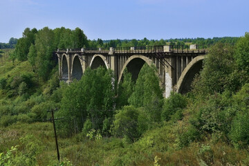 Fototapeta na wymiar An old 100-year-old viaduct
