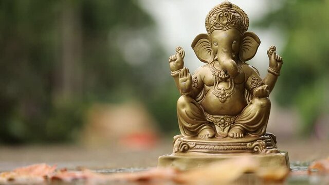 Water splash on lord ganesha sculpture. celebrate lord ganesha festival. 