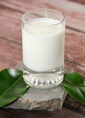white milk drink in a transparent glass