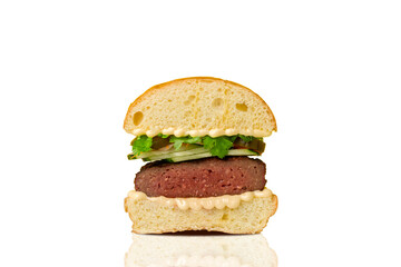 Burger cut in half on white background. Hamburger. Cheeseburger. 