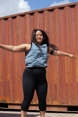 Young biracial woman with Down Syndrome in active wear and wearable tech working out