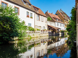 Colorful traditional french houses on the side of river Lauch in Colmar, France