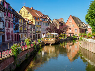 Colorful traditional french houses on the side of river Lauch in Colmar, France