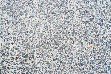 Gray white mosaic concrete in close up as a background