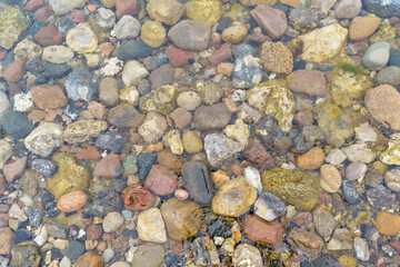 Stone background with Baltic Sea stones. Colorful stones.