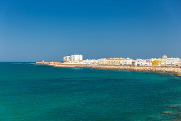 Fototapeta premium View of Cathedral Of Cadiz. Panoramic view of the city with promenade area and Mediterranean sea. Touristic travel destination in South of Spain. 