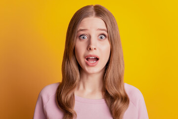 Photo of amazed crazy girl look camera open mouth on yellow background
