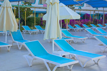 blue lounge chair in the garden at the pool	
