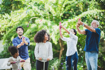 happy family together at home with various generation of children, mother, father, and grandfather, people who daughter smiling, African American and Caucasian childhood family relax leisure lifestyle