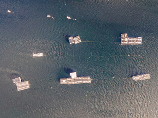 Aerial view of a floating structure for fishing in Lagoa de Albufeira, a lake in Setubal, Portugal