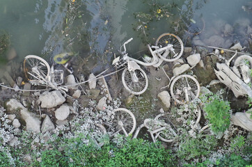 group of bicycles trown away