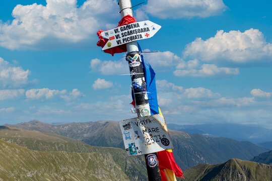 Vistea Mare Peak. Signposts on top of Vistea Mare.The Făgăraș Mountains from Romania.14.08.2021