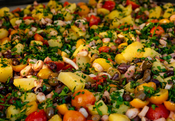 a large plate of octopus salad, typical Italian food