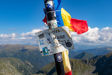 Vistea Mare Peak. Signposts on top of Vistea Mare.The Făgăraș Mountains from Romania.14.08.2021