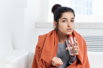 sick woman sitting at home cold treatment health problems