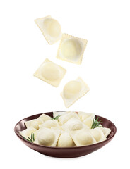 Uncooked ravioli falling into bowl on white background