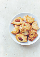 Butter cookies on bright stone background. Top view. Copy space. 