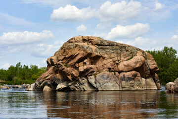 Summer landscape of fast Southern Bug river with rocks and water rapids